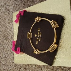 Kate Spade round gold bracelet with yellow stone